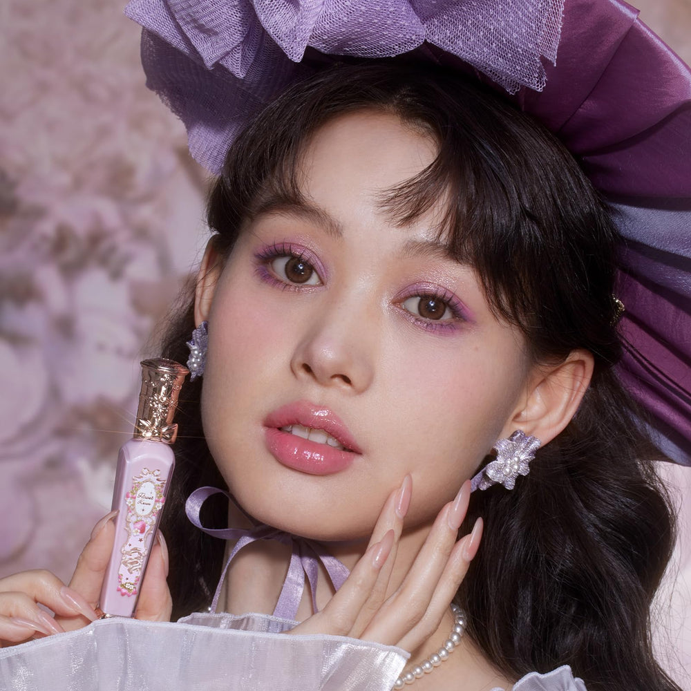 Flower Knows Violet Strawberry Rococo Glowy Lip Gloss gift-ready packaging on shelf.