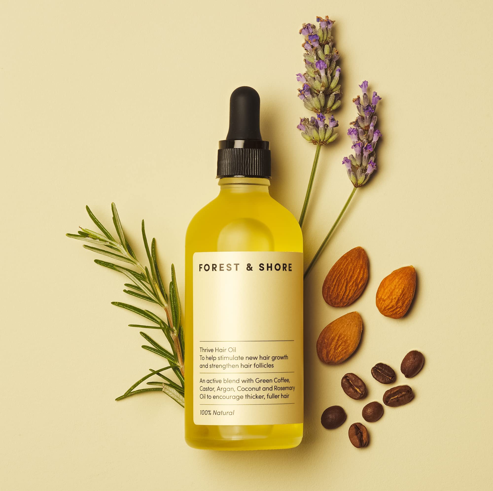 Forest & Shore Hair Growth Oil on wood background conveying premium, salon-quality blend