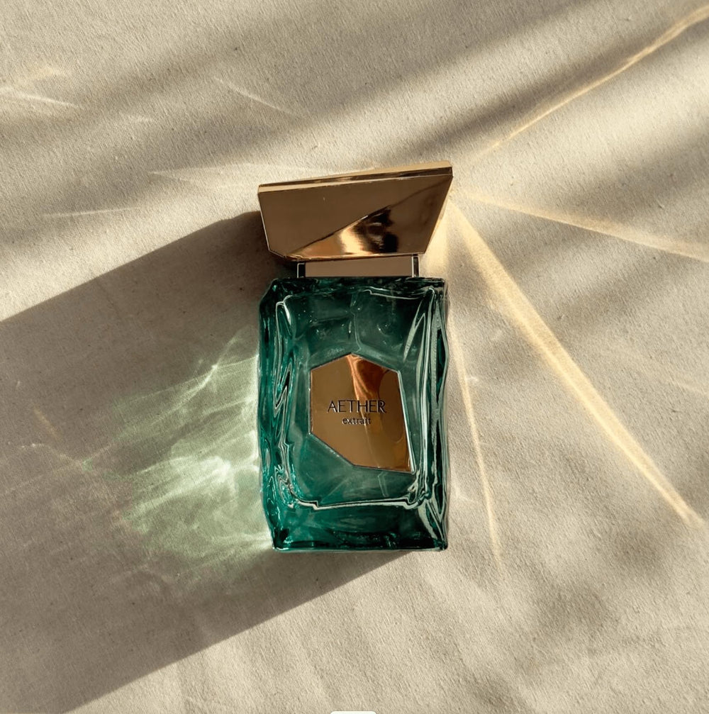 Fragrance World French Avenue Aether base-notes image shows musk and amberwood for depth
