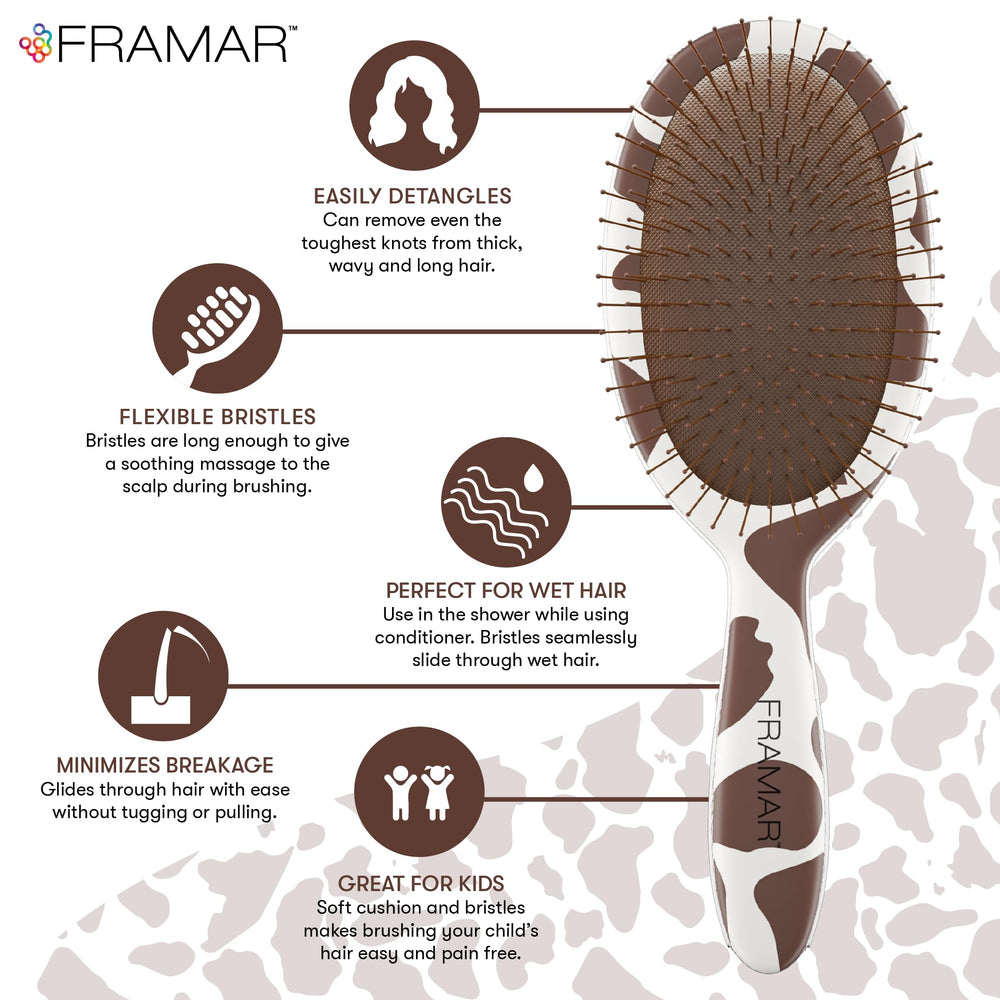 FRAMAR cow-print detangler brush handle close-up showing grip