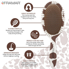 FRAMAR cow-print detangler brush handle close-up showing grip