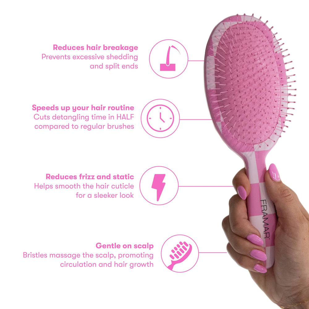 Framar pink-handled brush massaging scalp to boost circulation during brushing