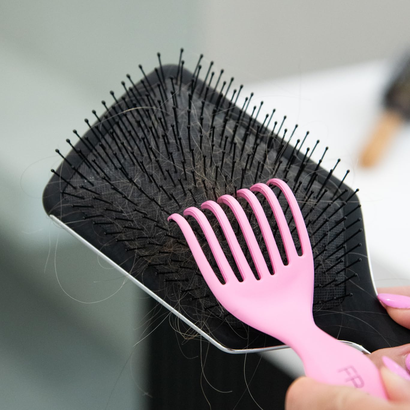 FRAMAR cleaner tool with fine wire bristles removes buildup around brush bases.