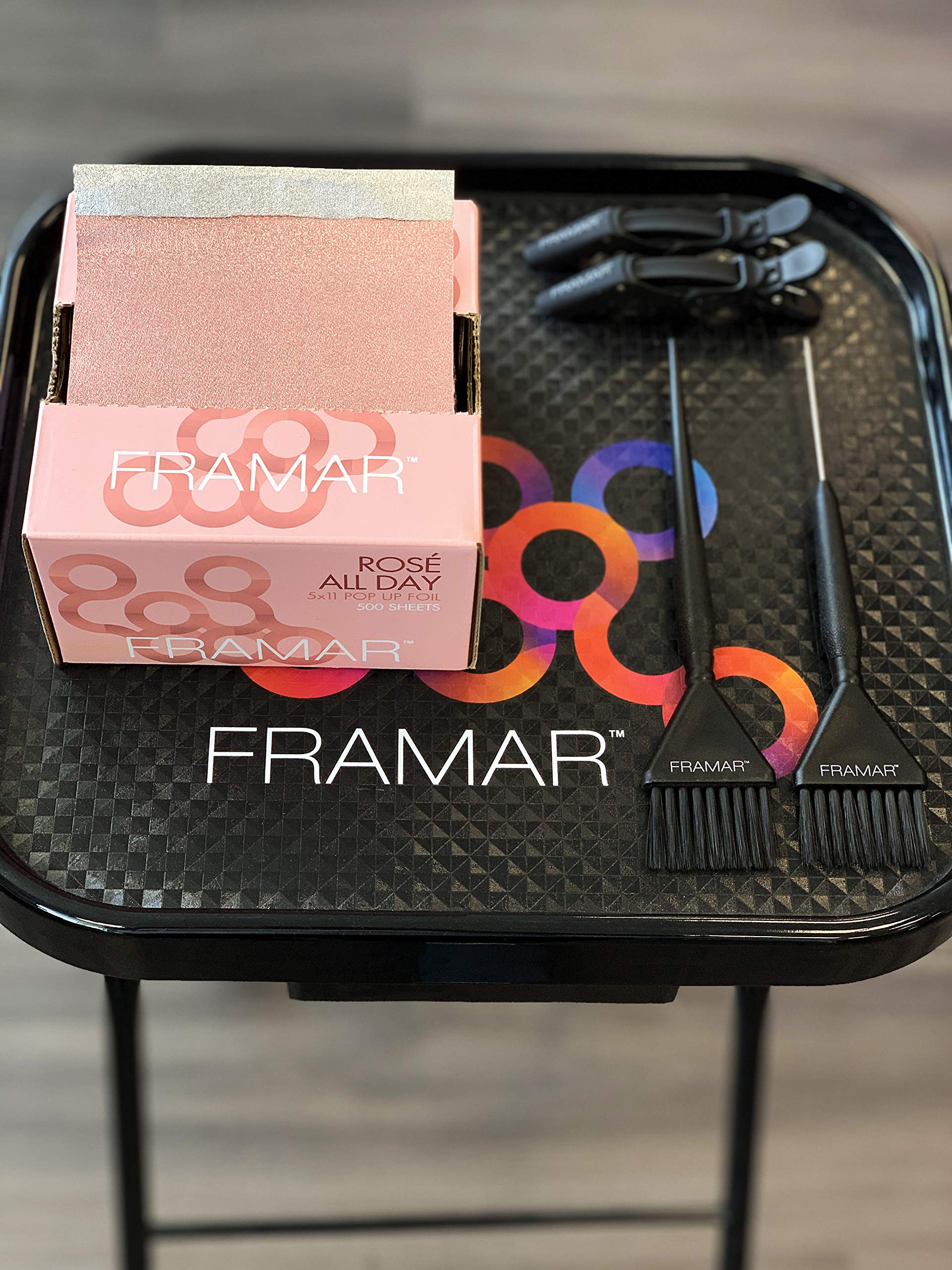 Framar Rosé foils organized at a busy salon station.