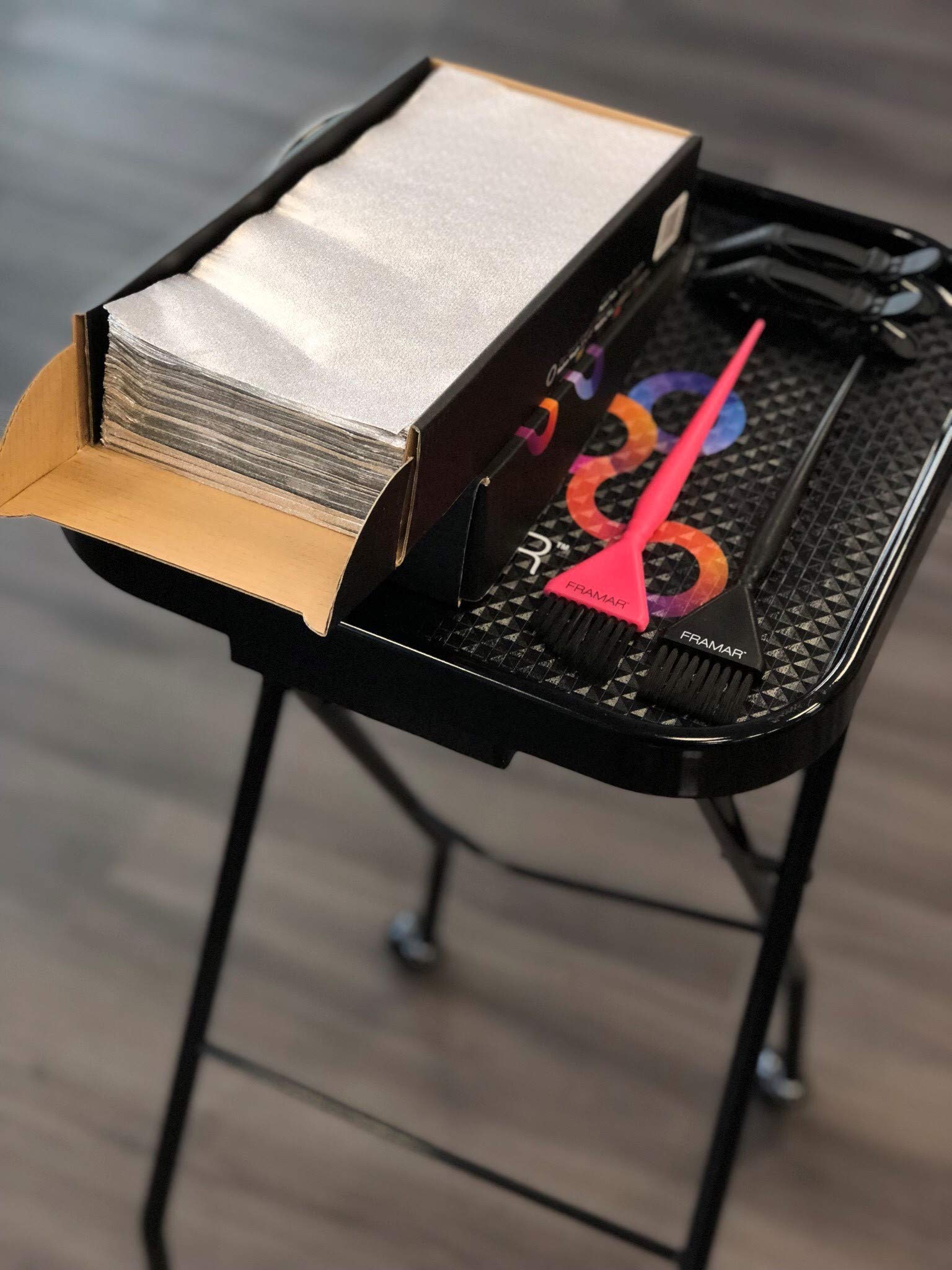 FRAMAR self-dispensing box shown open for easy foil access.