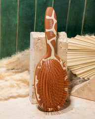 FRAMAR soft-plastic bristles glide through hair with minimal pulling.