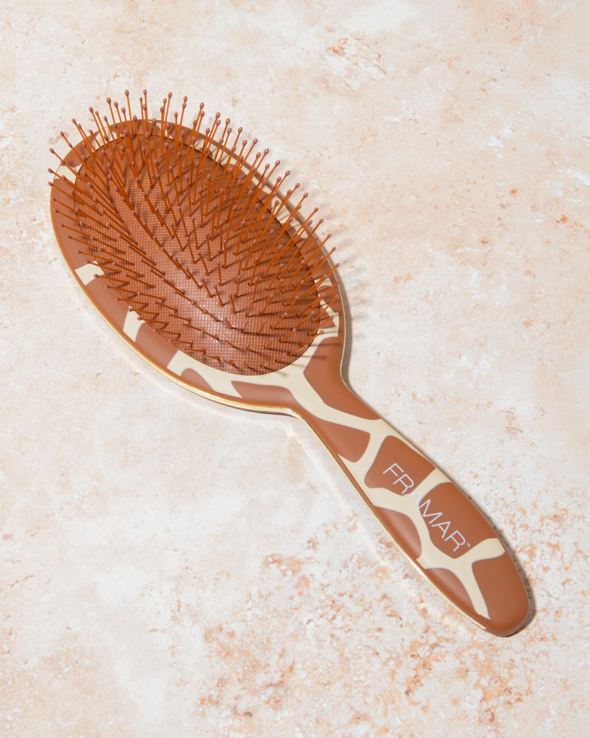 Framar Wet Hair Brush Detangler massaging scalp while detangling for improved circulation