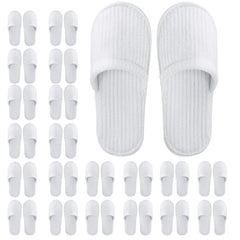 Frcctre white disposable slippers pack ready for guest use and travel.