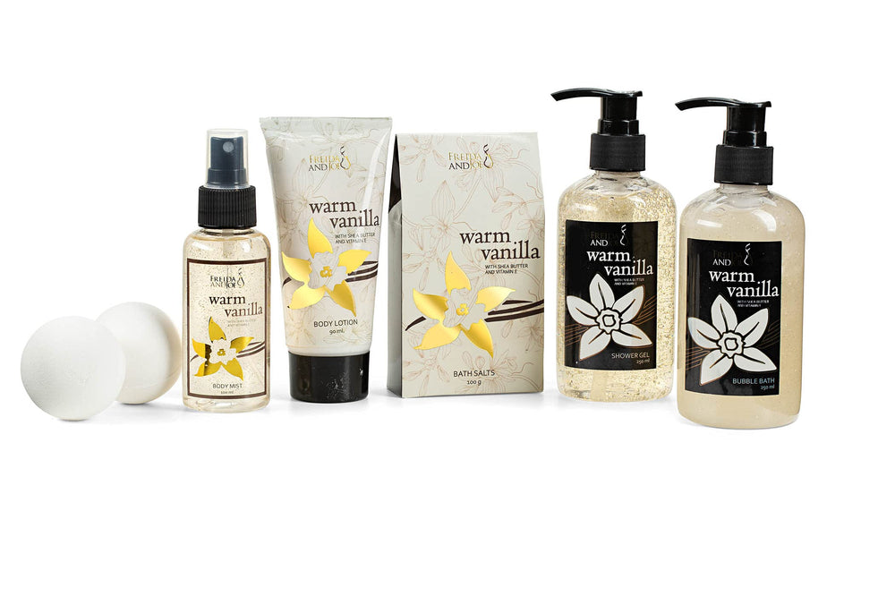 Freida and Joe Warm Vanilla spa set flatlay highlights luxurious shower and bubble bath for home spa moments.