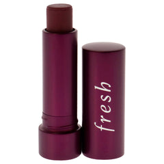 Fresh Sugar Lip Treatment Berry on lips showcases buildable tint.