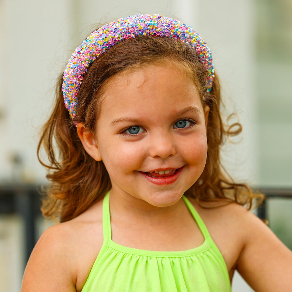 FROG SAC Headband on child image demonstrates cheerful sparkle for everyday wear.