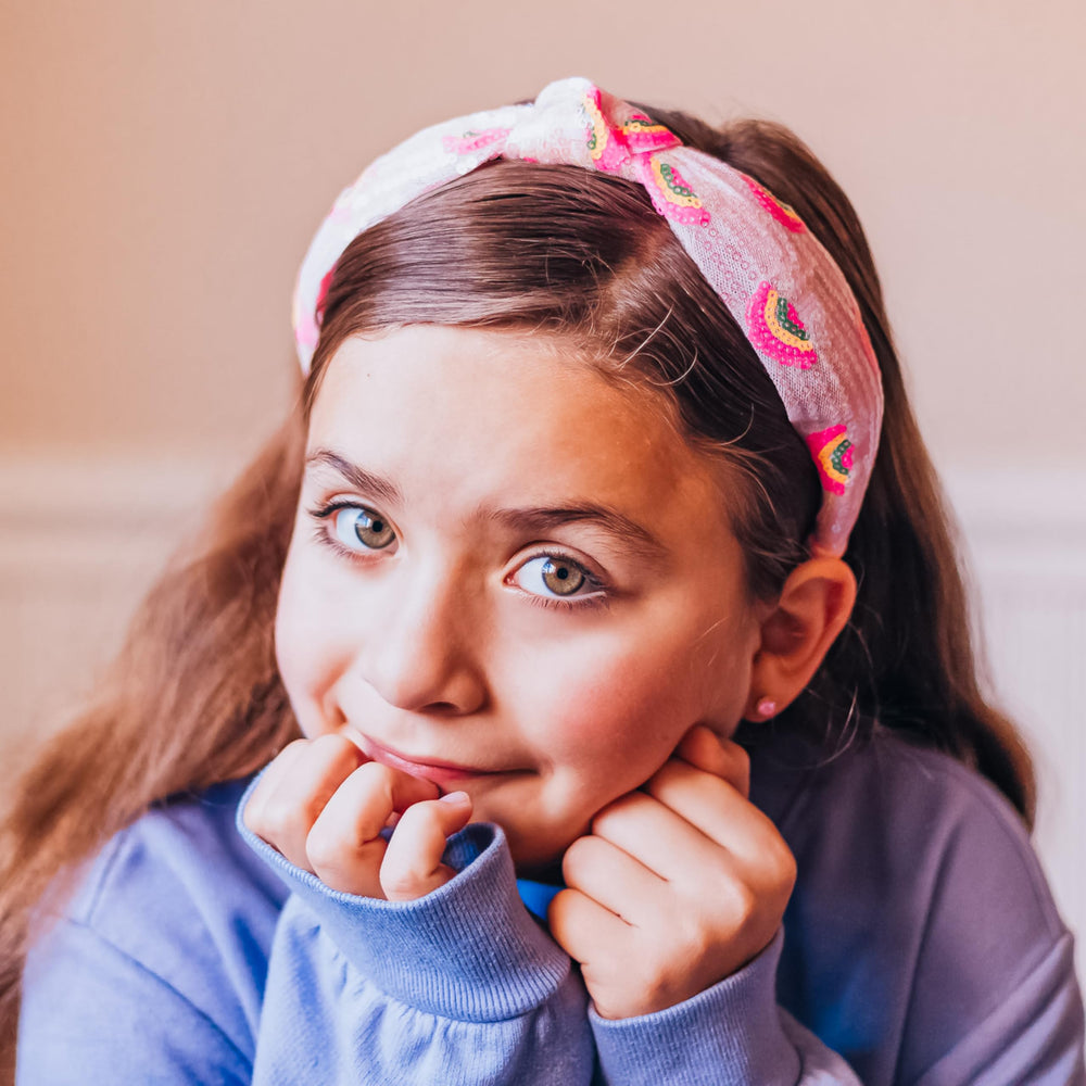 FROG SAC rainbow sequin headband elevates outfits with sparkling charm.