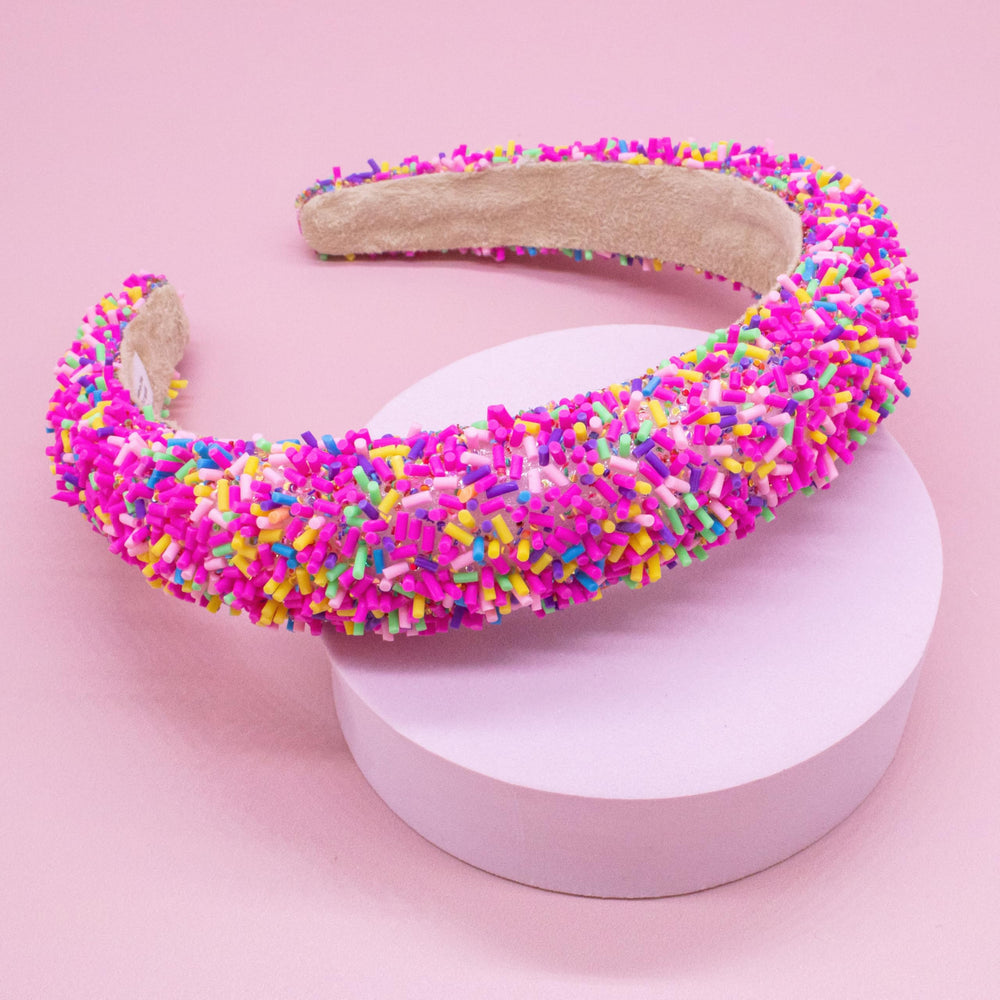 FROG SAC headband model wearing pink sprinkles demonstrates fashion-forward kids accessory