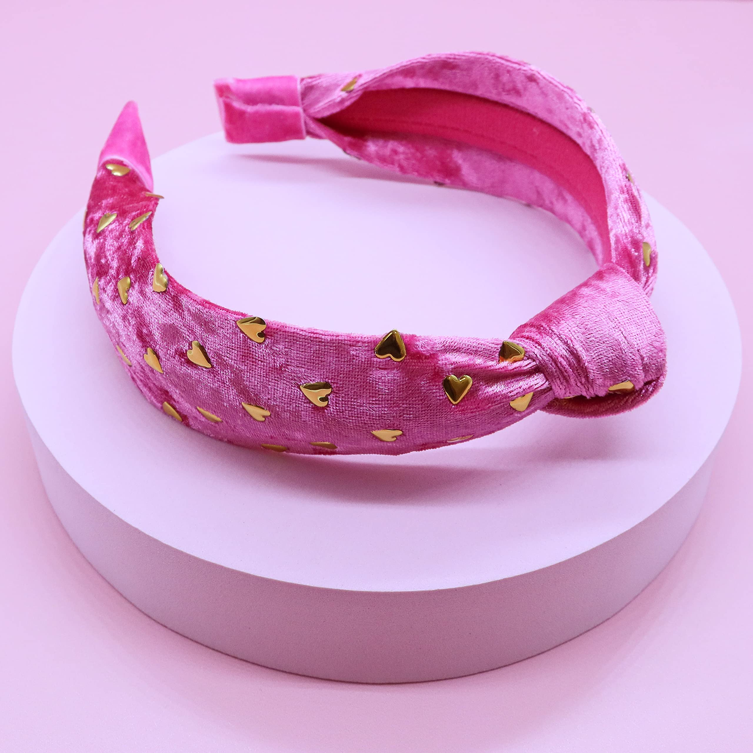 FROG SAC heart studs detail highlights gold accents and playful pink design.