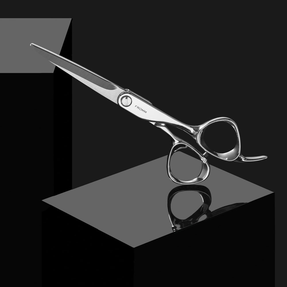 Fromm Professional Explore scissors resting on a salon desk ready for daily use