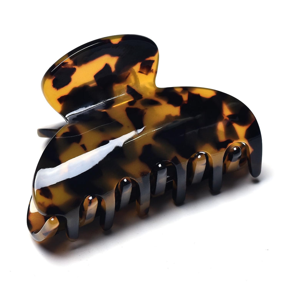 Fsmiling tortoise-shell clip held hair securely during daily activities.