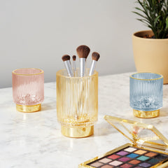 FullMeet crystal glass toothbrush holder in pink keeps bathroom items neatly aligned.
