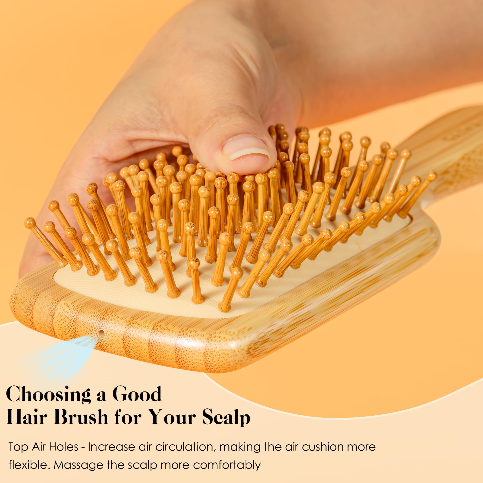 GAINWELL Bamboo Hair Brush ergonomic-handle closeup highlights comfortable grip for brushing sessions.