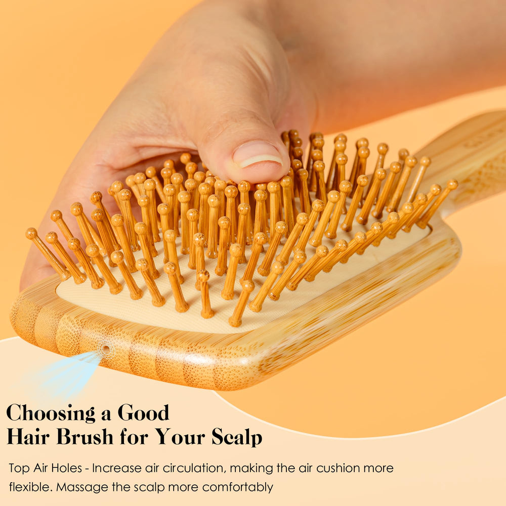 GAINWELL Bamboo Hair Brush ergonomic-handle closeup highlights comfortable grip for brushing sessions.