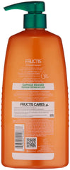 Garnier Fructis Damage Eraser Shampoo on hair during application for strength and repair.