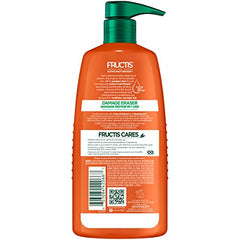 Garnier Fructis Damage Eraser Shampoo label close-up highlighting amla oil and vitamins.