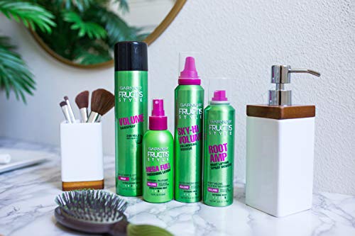 Garnier Fructis Root Amp spray nozzle dispensing a quick root lift on damp hair