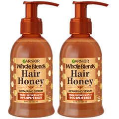 Garnier Whole Blends Honey Treasures serum bottle demonstrates non-greasy repair for damaged hair