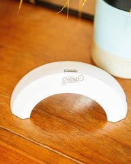 Gelish Pro 45 Mini LED Light four-finger cure close-up — speeds gel manicures with even coverage.