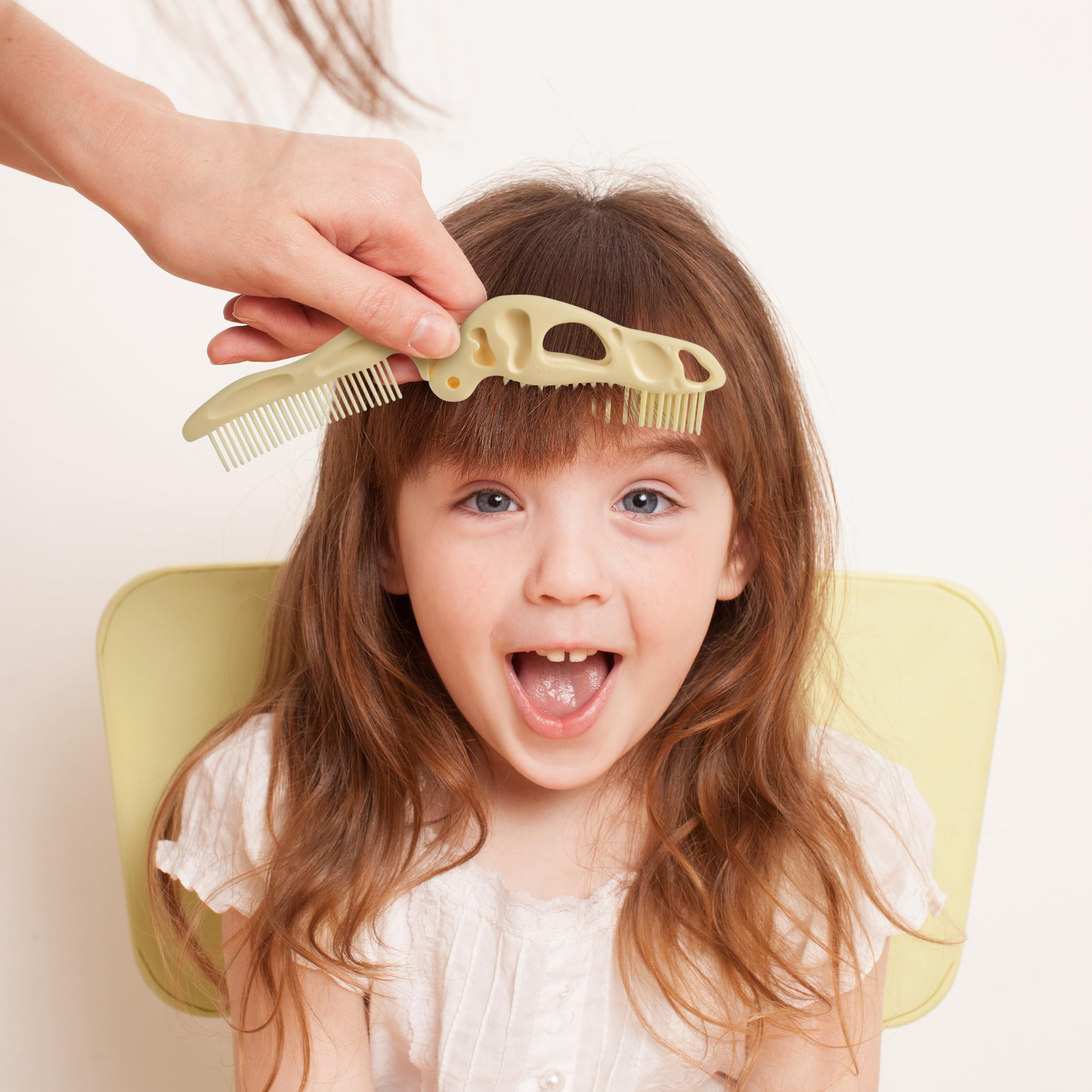 Genuine Fred Bonehead travel-size grooming tool fits diaper bags for quick touch-ups.