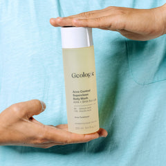 Geologie Acne Control Body Wash label closeup emphasizing fragrance-free, clean ingredients.