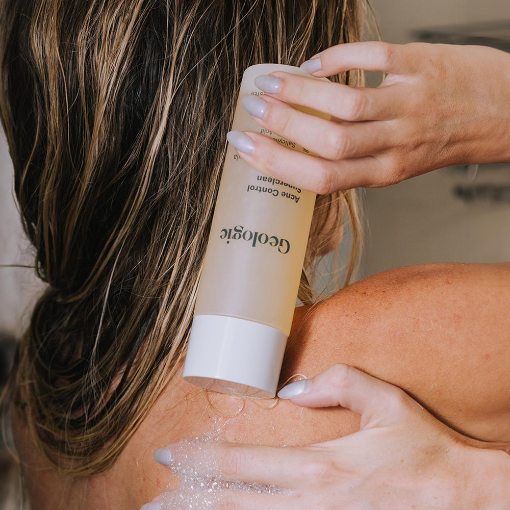 Geologie Acne Control Body Wash lather close-up showing gentle exfoliation.