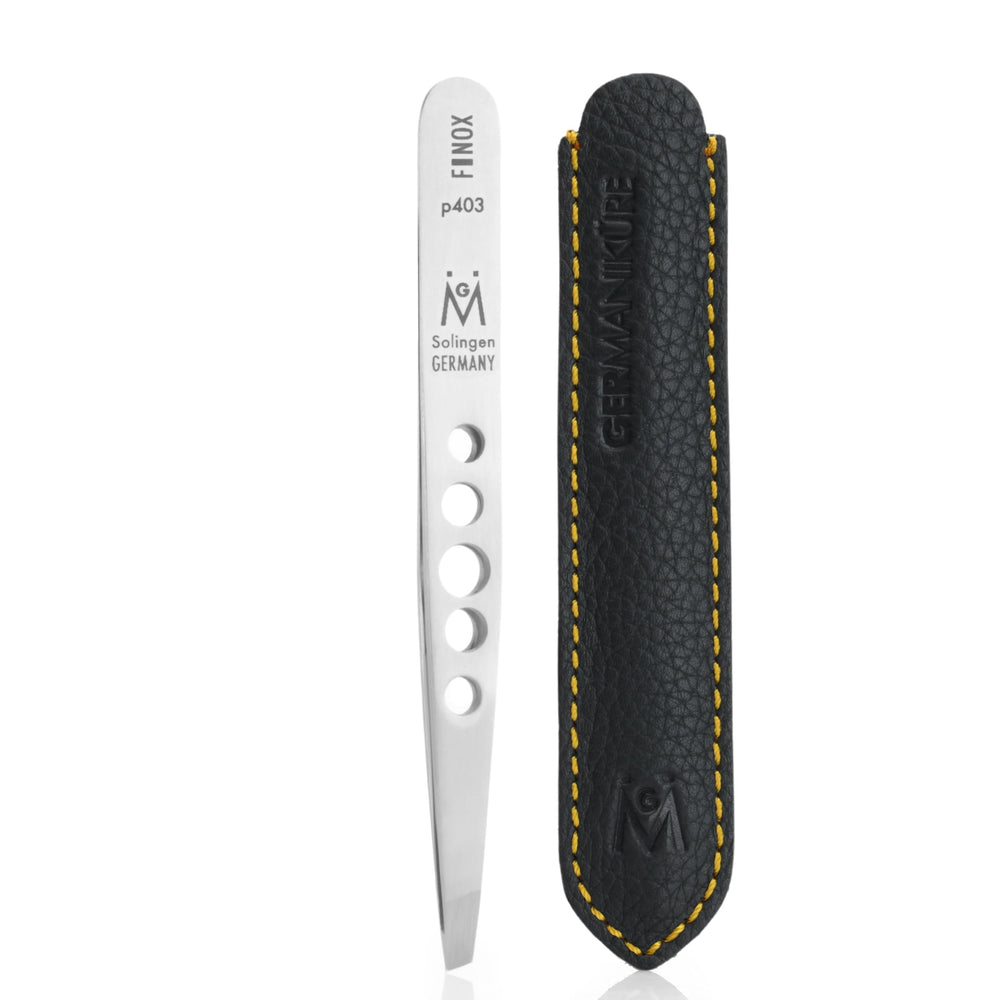 GERmanikure perforated slanted tweezers closeup showing precise tip for splinters and fine hairs.