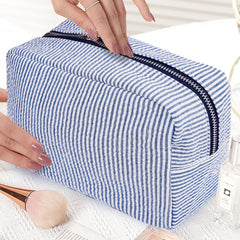 GFU makeup bag blue zipper detail emphasizes secure storage on the go