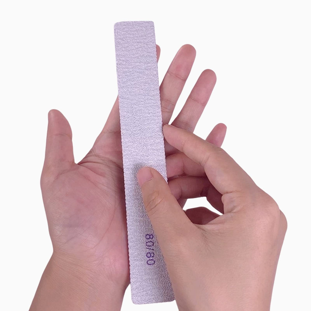 GigaGround ergonomic square nail file held for comfortable shaping.