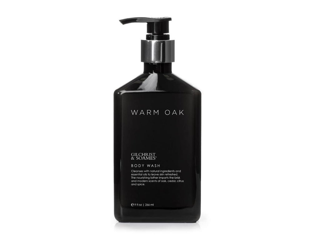 Gilchrist & Soames Warm Oak bottle pour for luxurious cleansing experience.