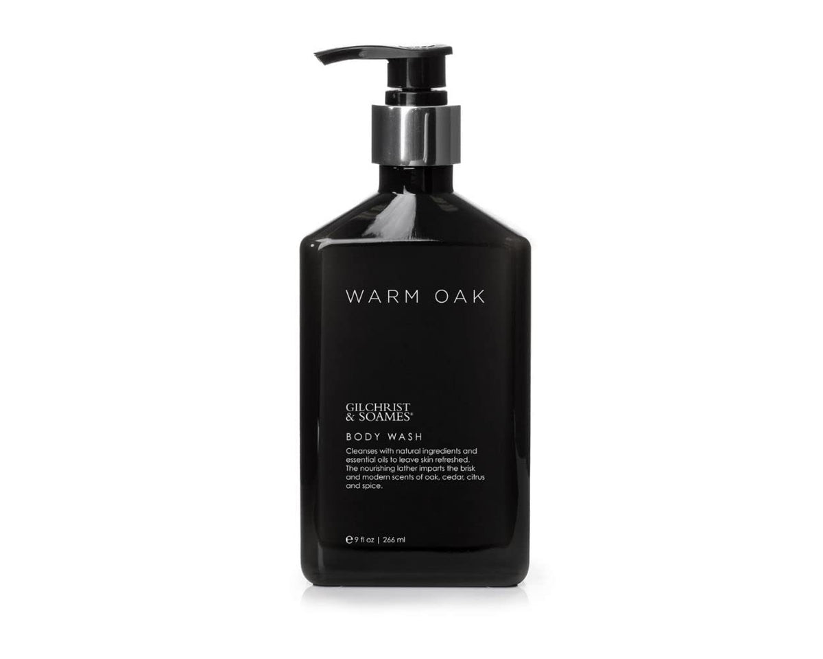 Gilchrist & Soames Warm Oak bottle pour for luxurious cleansing experience.