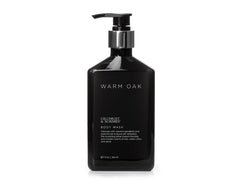 Gilchrist & Soames Warm Oak bottle pour for luxurious cleansing experience.