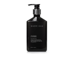 Gilchrist & Soames Warm Oak Shampoo bottle front promotes healthy-looking hair with a fresh aroma.
