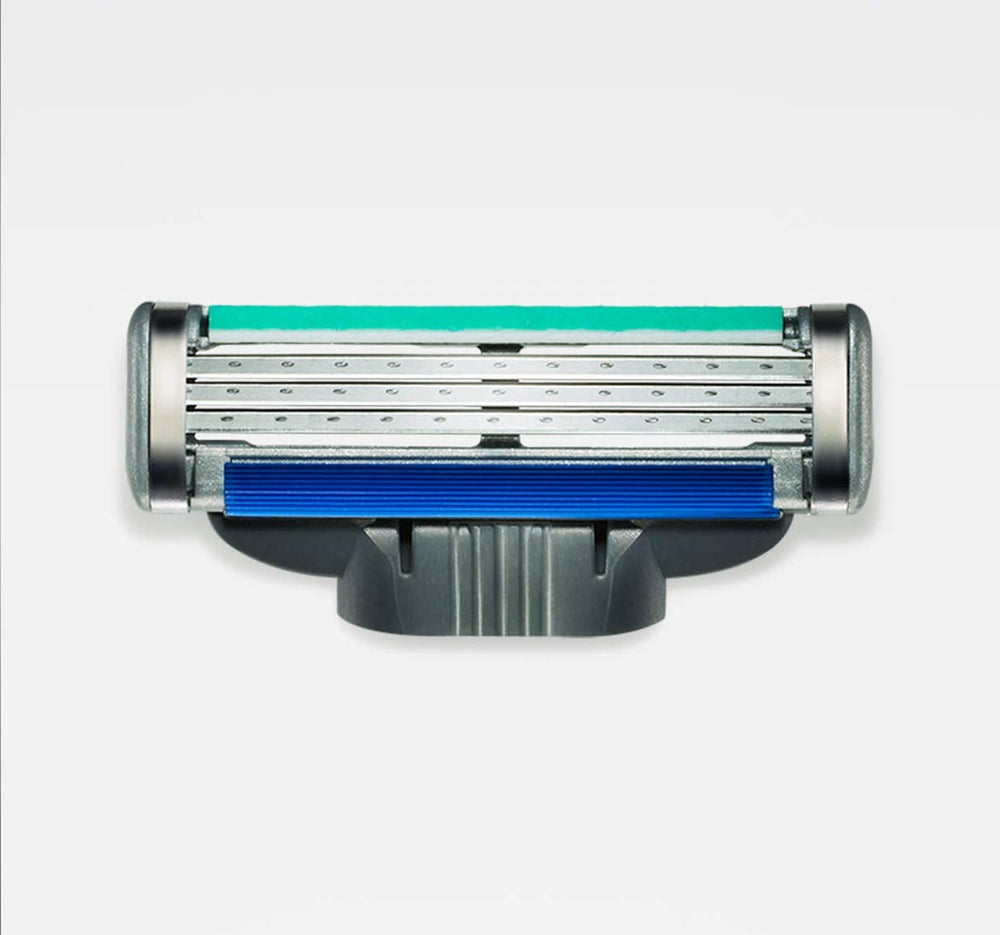 Close-up of Gillette Mach 3 Turbo refill blades showing three blades for a smooth shave.