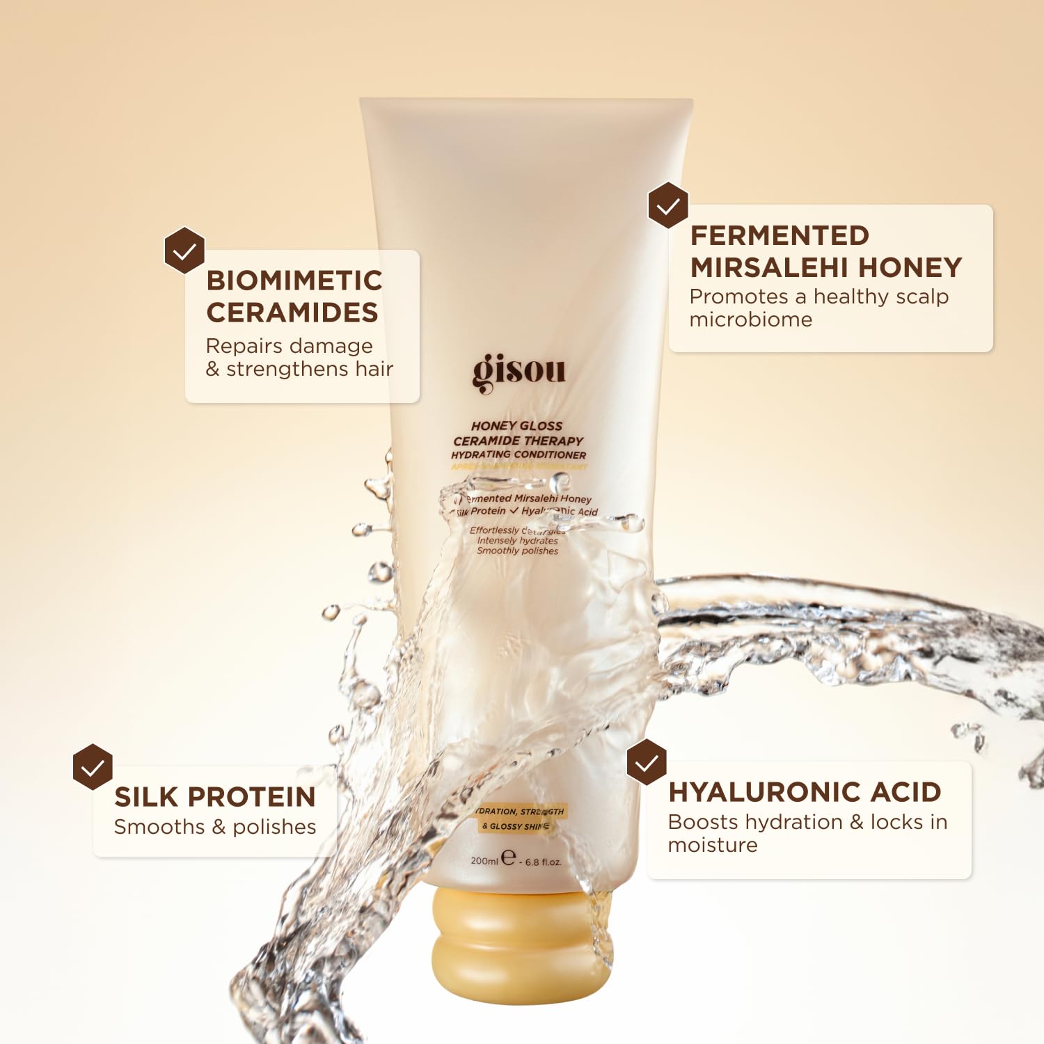 Gisou Honey Gloss conditioner being poured for easy detangling and shine.
