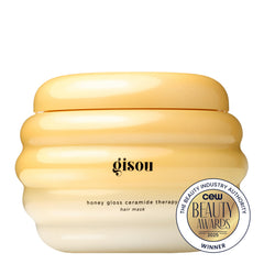 Gisou Honey Gloss Therapy Mask applied to hair section after washing