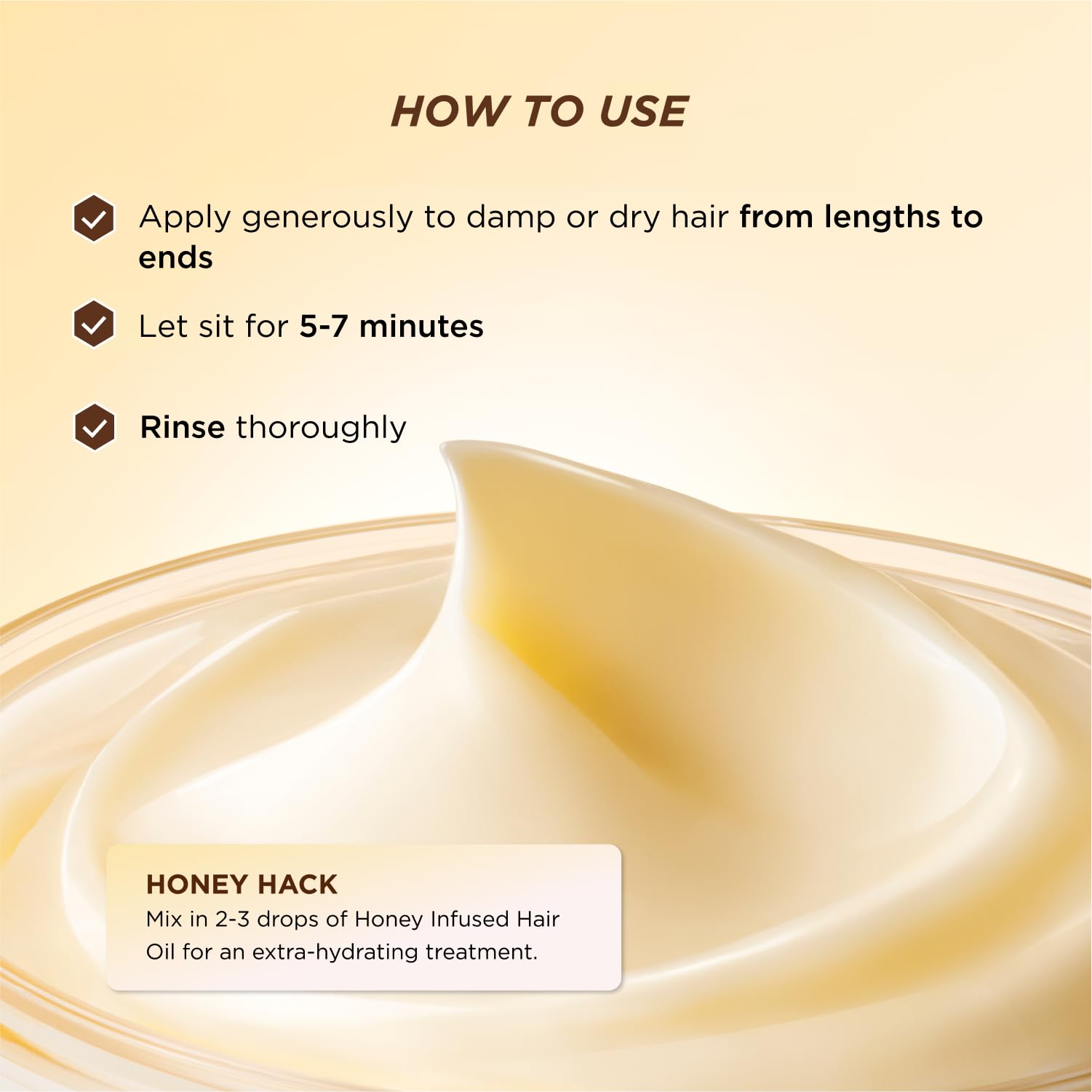 Gisou Honey-infused hair oil bottle complements mask for extra shine.
