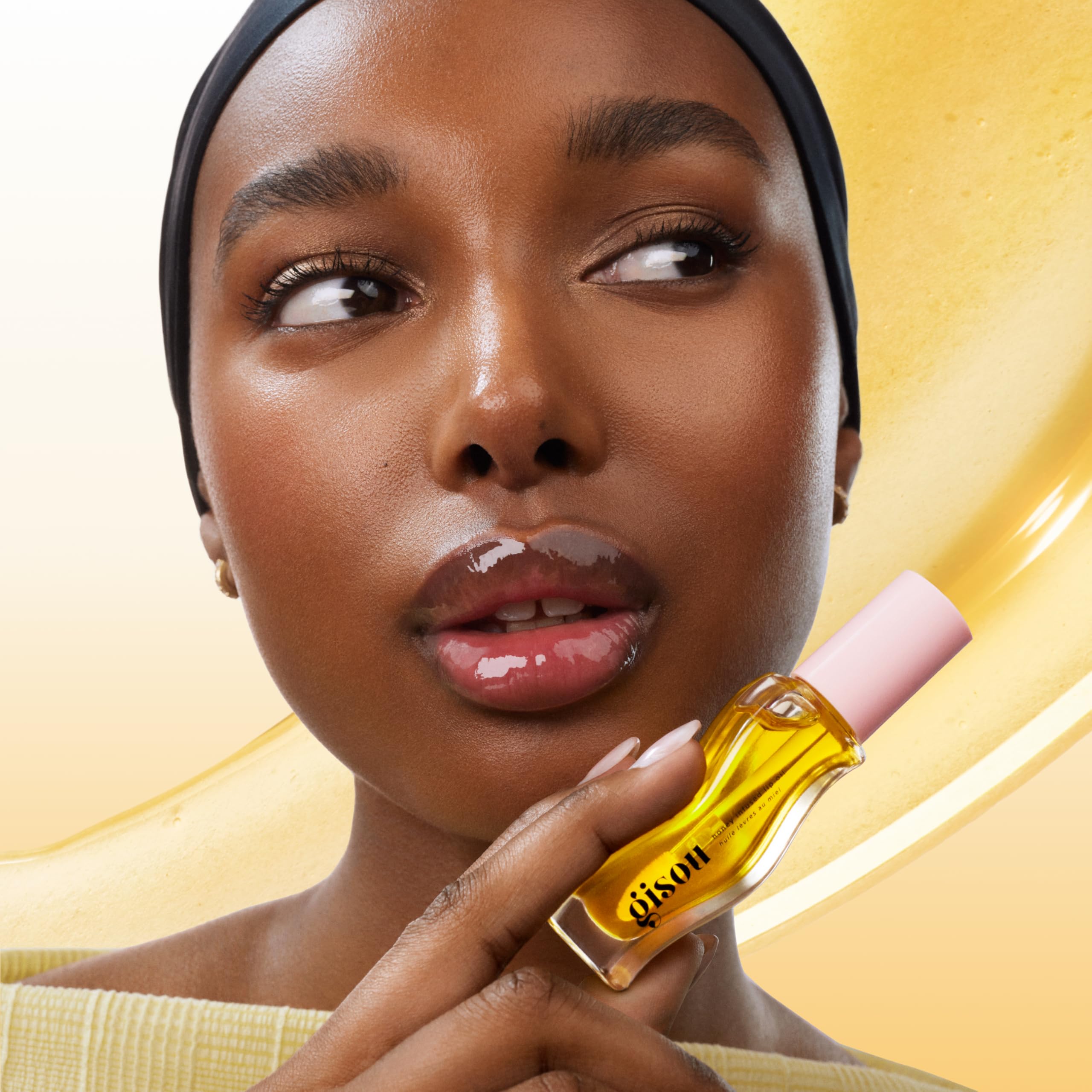 Gisou Honey Infused Lip Oil glossy finish on lips with no stickiness.
