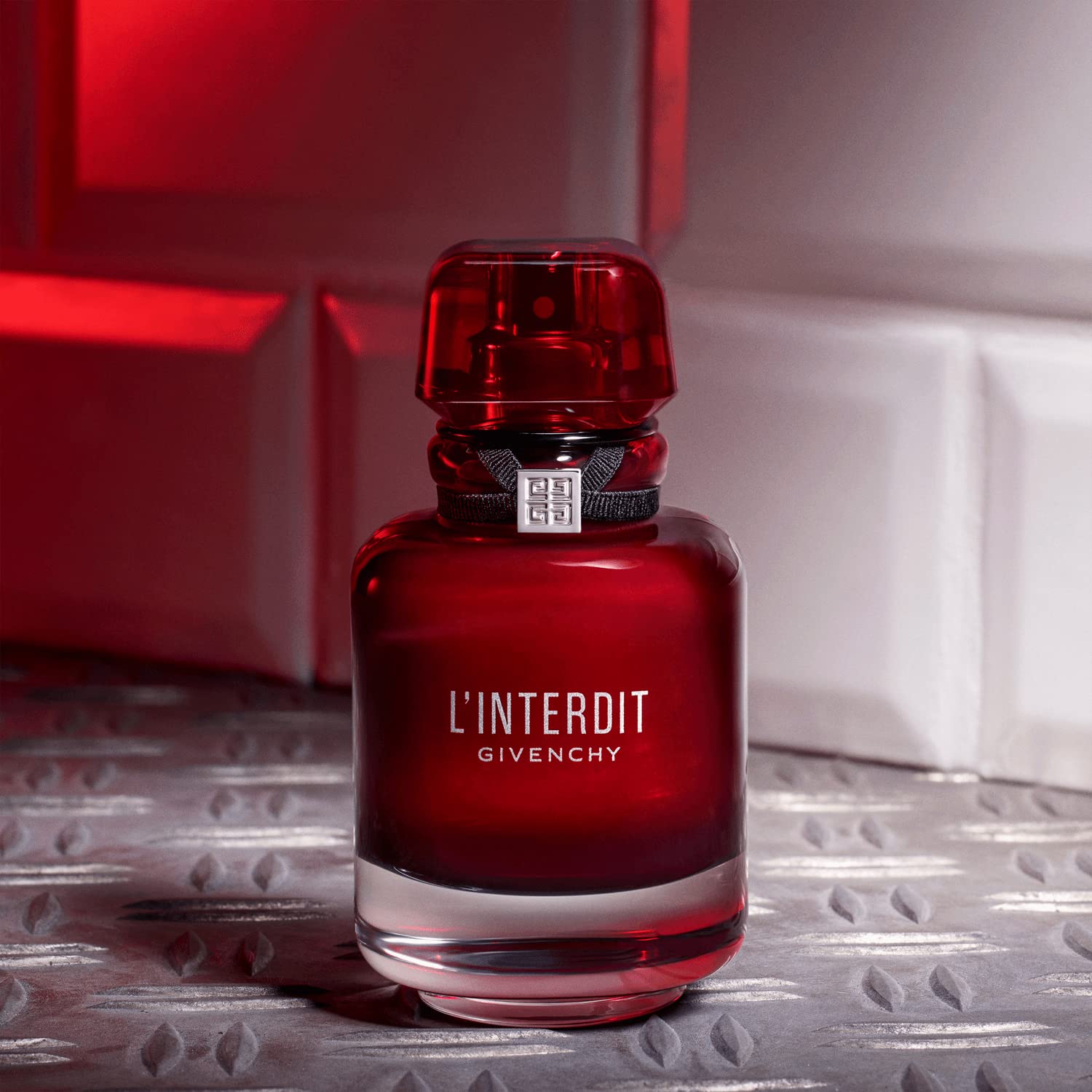 Givenchy L’Interdit Rouge cap reflects luxury packaging and premium feel.