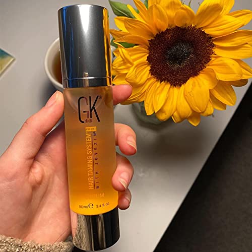 GK HAIR oil serum on glossy, nourished curls.