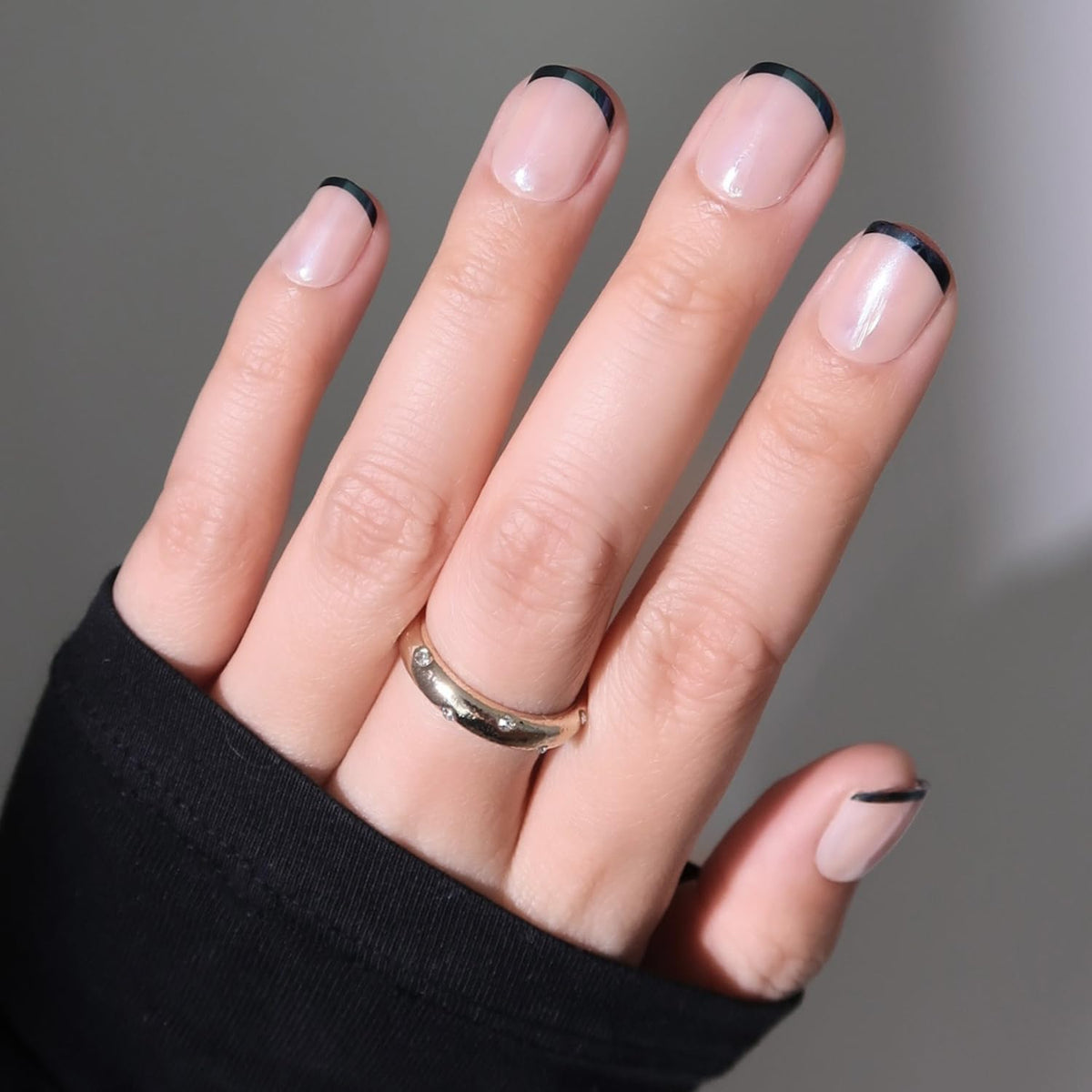 Glamnetic Burnt Miso nails close-up with glazed black tips for chic manicure.