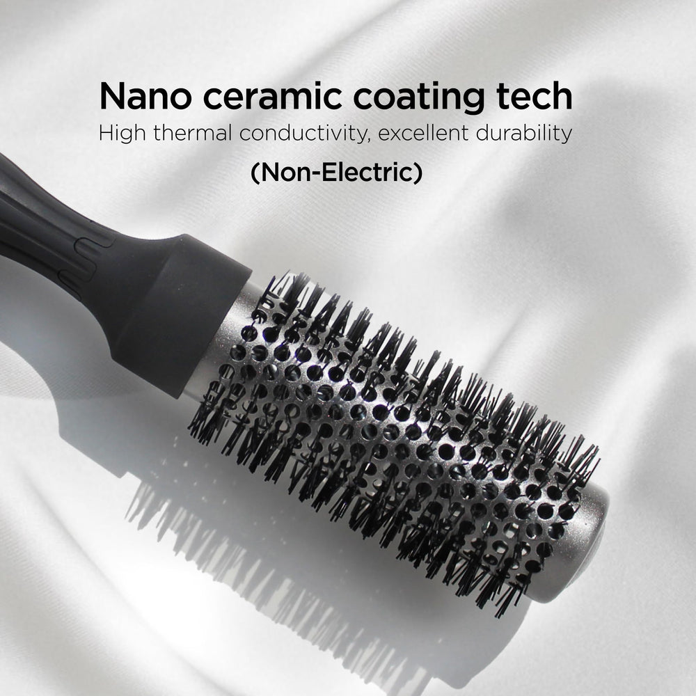 GLGL round brush demonstrates thick bangs lifted with root volume.
