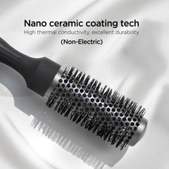 GLGL round brush demonstrates thick bangs lifted with root volume.
