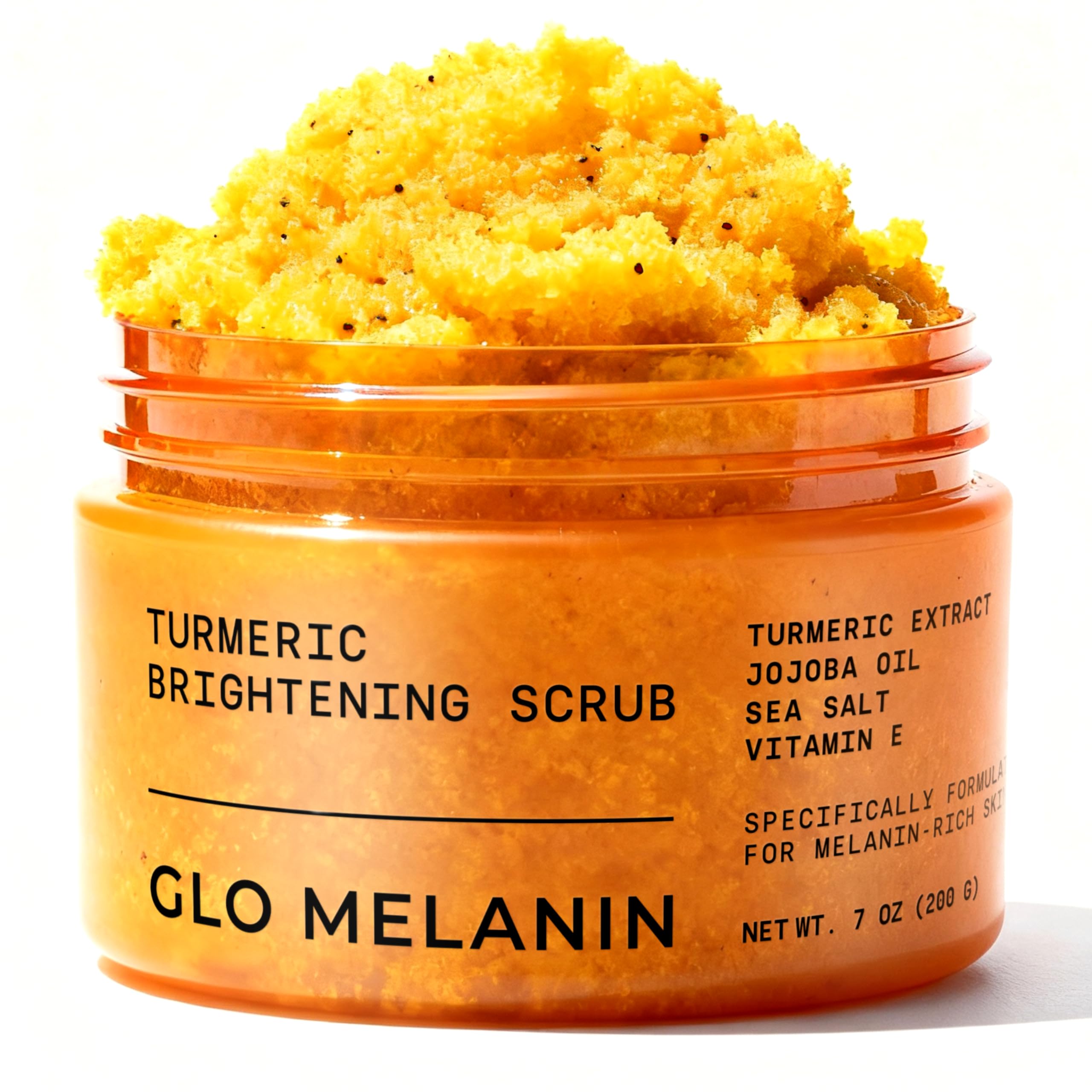 Glo Melanin Turmeric Scrub jar closeup promotes radiant skin and gentle exfoliation