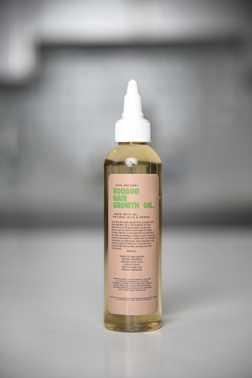 Glossed by Nae Voodoo Hair Growth Oil blend of castor and grapeseed oils supports ongoing hair care